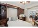 Bedroom featuring a Murphy bed, built-in shelving, a desk, and carpet flooring at 28351 N 130Th Dr, Peoria, AZ 85383