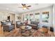 Spacious living room featuring natural light, hardwood floors, and a stylish area rug at 28351 N 130Th Dr, Peoria, AZ 85383