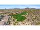 Scenic aerial view of a luxury neighborhood with a golf course winding through the desert landscape at 3529 N Boulder Canyon St, Mesa, AZ 85207