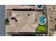 High angle view of a home with a pool, putting green, and neutral tone tile roof at 3529 N Boulder Canyon St, Mesa, AZ 85207