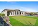 Expansive backyard with a well-manicured putting green and a sparkling pool at 3529 N Boulder Canyon St, Mesa, AZ 85207