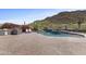 Backyard with an outdoor kitchen and a resort-style pool at 3529 N Boulder Canyon St, Mesa, AZ 85207