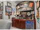 Built-in bar area with custom lighting, shelving, and a beverage cooler for entertaining at 3529 N Boulder Canyon St, Mesa, AZ 85207
