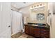 Well-lit bathroom with shower, spacious vanity with granite top, and plenty of storage space at 3529 N Boulder Canyon St, Mesa, AZ 85207
