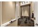 Elegant bathroom features a textured wall, decorative stone countertop, and modern glass vessel sink at 3529 N Boulder Canyon St, Mesa, AZ 85207