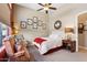 Cozy bedroom featuring a comfortable bed, accent chair, and a bright window offering natural light at 3529 N Boulder Canyon St, Mesa, AZ 85207