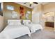 Comfortable bedroom featuring two beds and an ensuite bathroom with stylish decor and ample natural light at 3529 N Boulder Canyon St, Mesa, AZ 85207