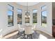Bright dining area with mountain views from surrounding windows near pool at 3529 N Boulder Canyon St, Mesa, AZ 85207