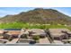 Exterior view of a single-Gathering home with desert landscaping near a golf course and mountain at 3529 N Boulder Canyon St, Mesa, AZ 85207