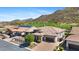 Expansive single-Gathering home backing up to a lush golf course, showcasing desert landscaping and mountain views at 3529 N Boulder Canyon St, Mesa, AZ 85207