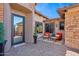 Inviting entrance with brick pavers, manicured plants, covered entryway, and seating area at 3529 N Boulder Canyon St, Mesa, AZ 85207