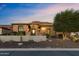 Inviting single-story home with desert landscaping, stone accents, and mountain views at 3529 N Boulder Canyon St, Mesa, AZ 85207