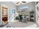 Spacious home office offering a scenic view, functional workspace, and a peek into an adjacent bathroom at 3529 N Boulder Canyon St, Mesa, AZ 85207