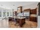 Gourmet kitchen boasts custom cabinets, a large island, stainless appliances, and a built-in microwave at 3529 N Boulder Canyon St, Mesa, AZ 85207