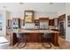 Beautiful kitchen features custom wood cabinetry, a large center island, stainless steel appliances, and tile floors at 3529 N Boulder Canyon St, Mesa, AZ 85207