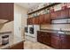 Functional laundry room with modern washer and dryer, storage cabinets, and ample countertop space at 3529 N Boulder Canyon St, Mesa, AZ 85207