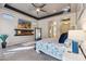 Large main bedroom with modern decor, floating fireplace, and scenic views from the windows at 3529 N Boulder Canyon St, Mesa, AZ 85207
