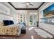 Spacious main bedroom with sitting area, outdoor access, and modern ceiling fan at 3529 N Boulder Canyon St, Mesa, AZ 85207