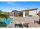 Backyard view with a refreshing pool, patio area, and outdoor seating, perfect for relaxation and entertainment at 3529 N Boulder Canyon St, Mesa, AZ 85207