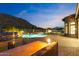 Backyard with built-in grill, fire feature, and serene pool and spa area at 3529 N Boulder Canyon St, Mesa, AZ 85207