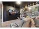 Cozy home theater featuring a large screen TV, comfortable seating, and wall decorations at 3529 N Boulder Canyon St, Mesa, AZ 85207