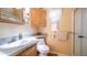 Bathroom features a tile countertop, toilet, vanity, and shower with glass door at 359 Felspar Dr, Apache Junction, AZ 85119