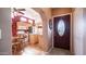 View of a home's entryway and kitchen area with warm lighting and modern decor at 359 Felspar Dr, Apache Junction, AZ 85119