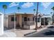 Charming exterior of a home with palm trees, covered porch, and inviting curb appeal at 359 Felspar Dr, Apache Junction, AZ 85119