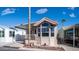 Inviting home exterior with a covered porch, desert landscaping, and bright curb appeal at 359 Felspar Dr, Apache Junction, AZ 85119