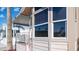 Close-up of a home's exterior with large windows and a charming covered porch at 359 Felspar Dr, Apache Junction, AZ 85119