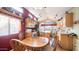 Bright kitchen with light cabinets, stainless appliances, and cozy dining area at 359 Felspar Dr, Apache Junction, AZ 85119