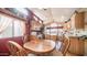 Cozy kitchen and dining area featuring light oak cabinetry, stainless steel appliances, and ample natural light at 359 Felspar Dr, Apache Junction, AZ 85119