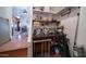 The workshop features built-in shelves and a workbench with an entryway to the living room at 359 Felspar Dr, Apache Junction, AZ 85119