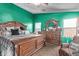 Spacious bedroom with a large bed, dark wood furniture, and ample natural light at 36469 W Alhambra St, Maricopa, AZ 85138