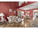 Stately living room featuring high ceilings, custom display shelves, and elegant furnishings at 36469 W Alhambra St, Maricopa, AZ 85138