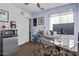 Office with a glass desk, comfortable seating, and natural lighting at 36469 W Alhambra St, Maricopa, AZ 85138