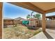 Spacious backyard featuring a shed, gazebo, and ample space for outdoor activities at 38085 W San Capistrano Ave, Maricopa, AZ 85138