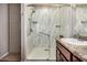 Modern bathroom featuring a sleek shower with glass doors and stylish vanity at 38085 W San Capistrano Ave, Maricopa, AZ 85138