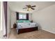Relaxing primary bedroom featuring a ceiling fan and carpet floors at 38085 W San Capistrano Ave, Maricopa, AZ 85138