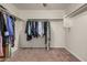 Spacious walk-in closet features ample hanging space, carpet flooring, and a ceiling fan with overhead lighting at 38085 W San Capistrano Ave, Maricopa, AZ 85138