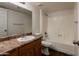 Bathroom features a shower and bath combo, as well as a vanity at 3810 N Maryvale Pkwy # 2029, Phoenix, AZ 85031