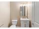 Half bath featuring a sleek vanity with modern fixtures, and a toilet at 4216 N 27Th St # 108, Phoenix, AZ 85016