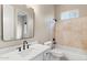Well-lit bathroom with modern fixtures and a tiled shower-tub combo at 4216 N 27Th St # 108, Phoenix, AZ 85016