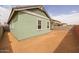 Backyard view of the green exterior, showing the landscaping potential with room for creativity at 4265 E John St, Gilbert, AZ 85295