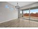 Bright dining area with chandelier and sliding glass doors to the backyard at 4265 E John St, Gilbert, AZ 85295