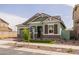 Beautiful single-Gathering home featuring manicured landscaping, stylish wood accents, and a welcoming entrance at 4265 E John St, Gilbert, AZ 85295