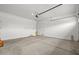 Clean, bright garage with smooth concrete flooring and ample space for storage at 4265 E John St, Gilbert, AZ 85295