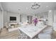 Open living and dining area with stylish furnishings and a view of the kitchen at 4265 E John St, Gilbert, AZ 85295