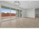 Spacious living area with tile flooring, sliding glass doors, and view to the backyard at 4265 E John St, Gilbert, AZ 85295