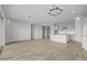 Open concept living space with tile floors, recessed lighting, and views into the kitchen at 4265 E John St, Gilbert, AZ 85295